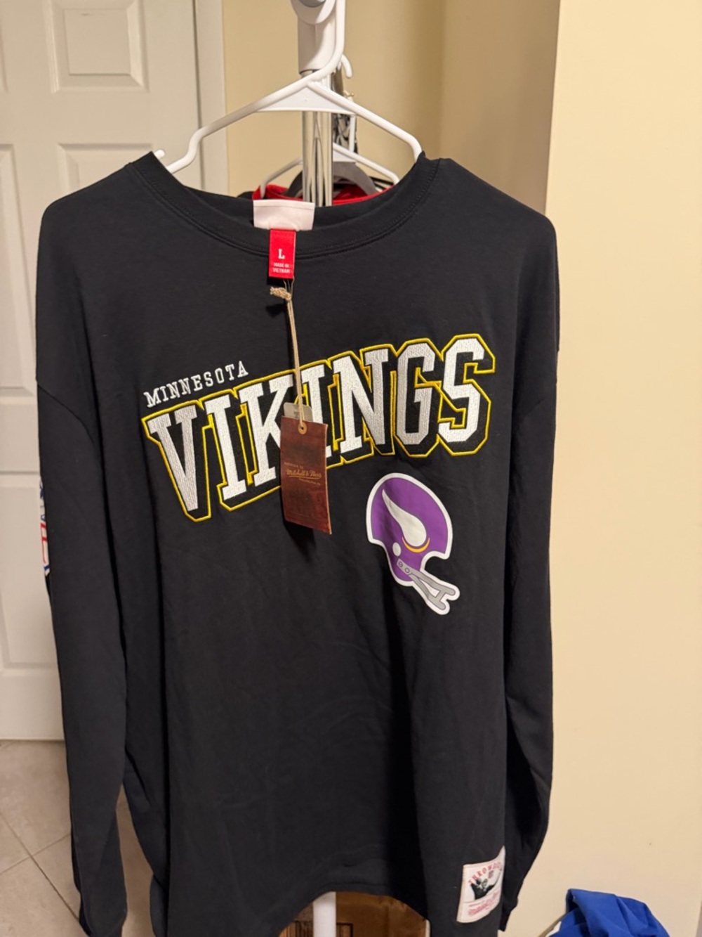 Minnesota Vikings Black Long Sleeve Tee with Purple Helmet Graphic